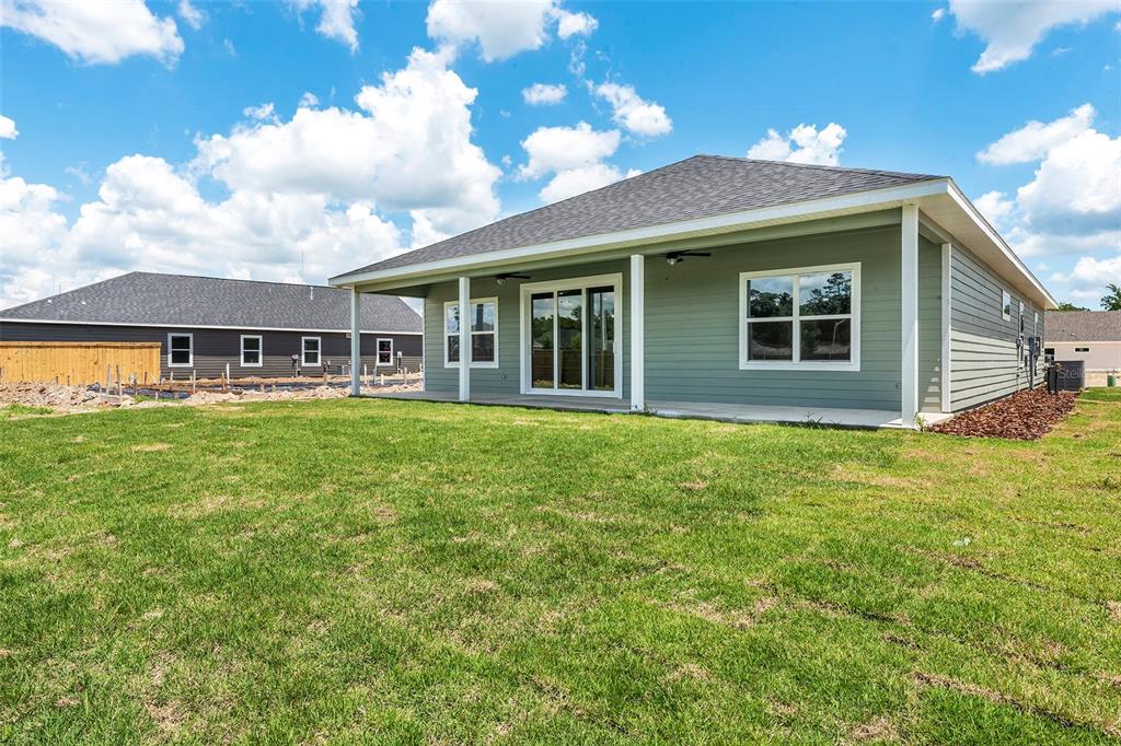 6723 Southwest 15 Place Gainesville, FL 32607 - Photo 24 of 24 a house view with swimming pool and garden space