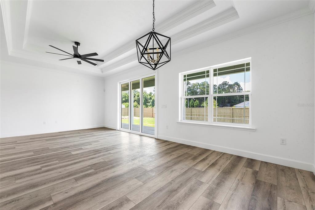 6723 Southwest 15 Place Gainesville, FL 32607 - Photo 6 of 24 a view of an empty room with window and wooden floor