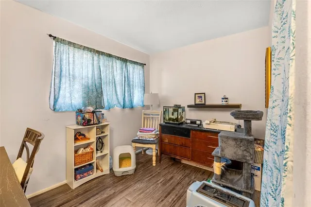 a room with furniture a rug and a window