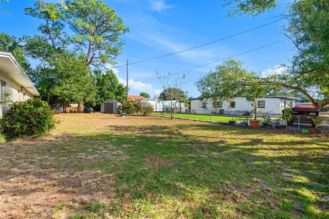a swimming pool view with a outdoor seating
