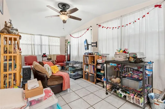 a living room with lots of furniture and a chandelier