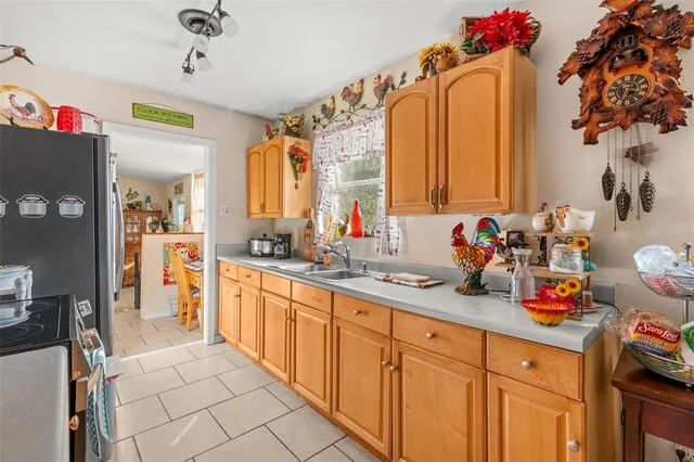 a kitchen with sink cabinets and window