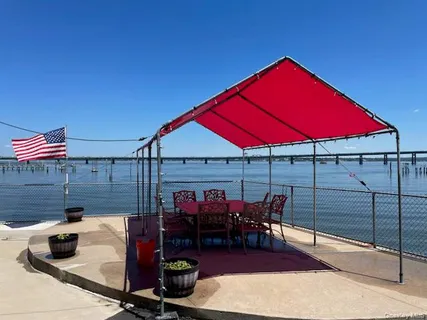 a view of swimming pool with a table and chairs