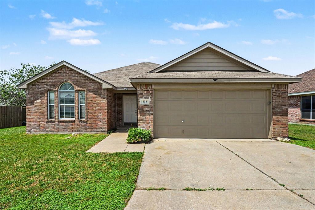 138 Kings Way Drive Rhome, TX 76078 - Photo 1 of 16 a front view of a house with a yard and garage