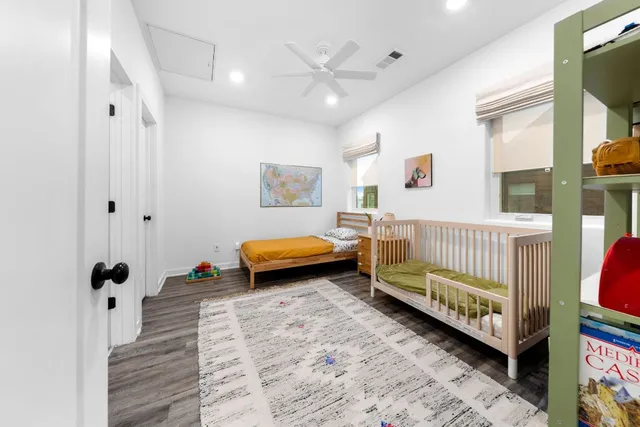 a view of a workspace with furniture and a bedroom