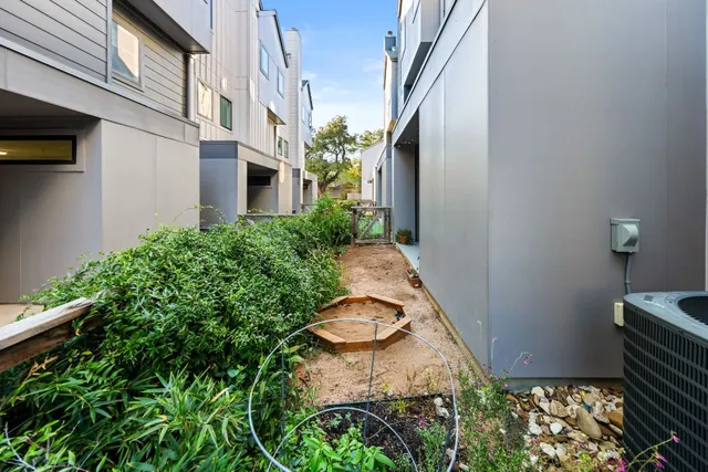 a view of a building with potted plants