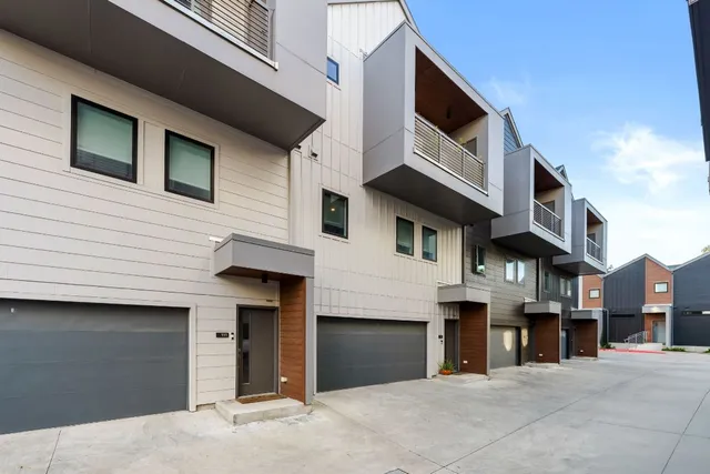 a view of a house with iron stairs