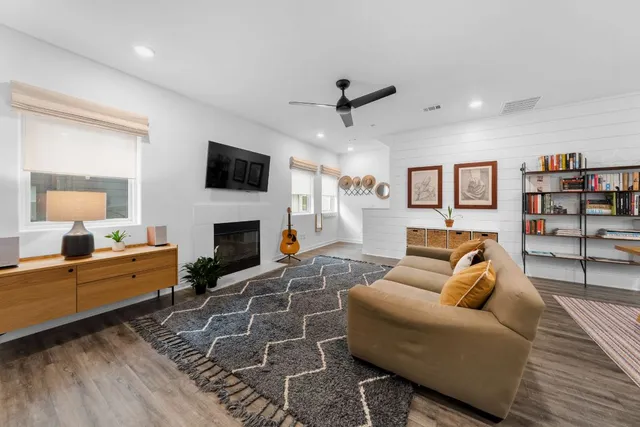 a living room with furniture or flat screen tv and a fireplace