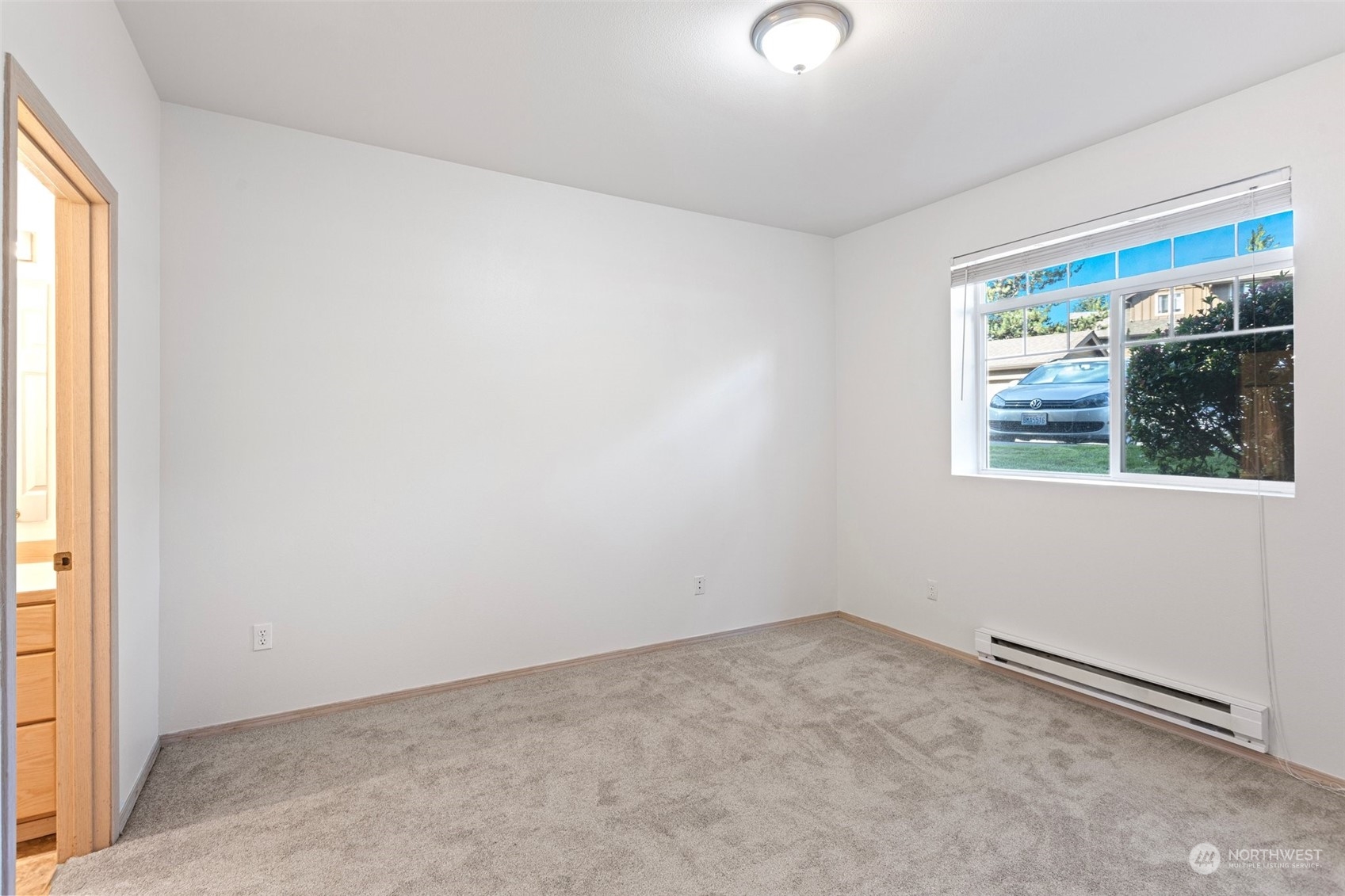 18930 Bothell Everett Highway, Unit V104 Bothell, WA 98012 - Photo 12 of 21 an empty room with a window