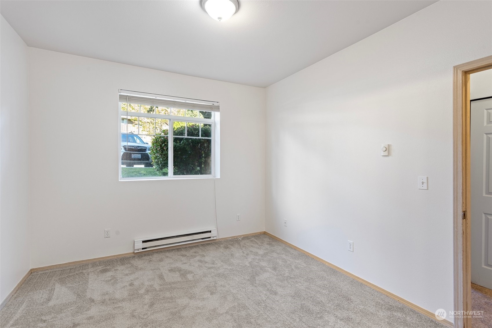 18930 Bothell Everett Highway, Unit V104 Bothell, WA 98012 - Photo 13 of 21 an empty room with a window