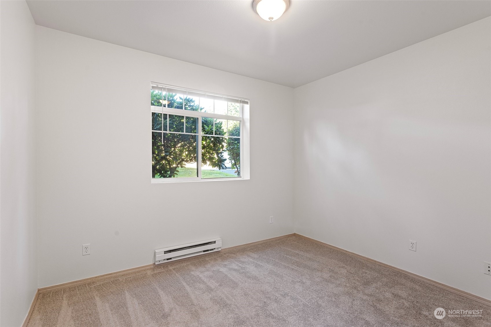 18930 Bothell Everett Highway, Unit V104 Bothell, WA 98012 - Photo 16 of 21 an empty room with a window