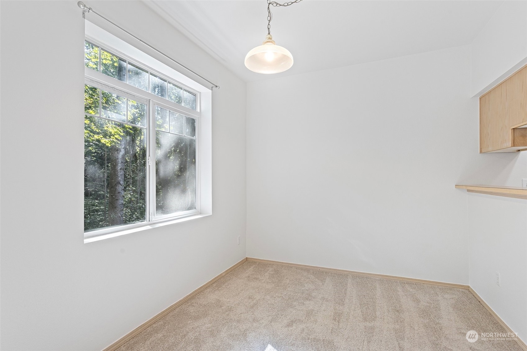 18930 Bothell Everett Highway, Unit V104 Bothell, WA 98012 - Photo 18 of 21 an empty room with windows
