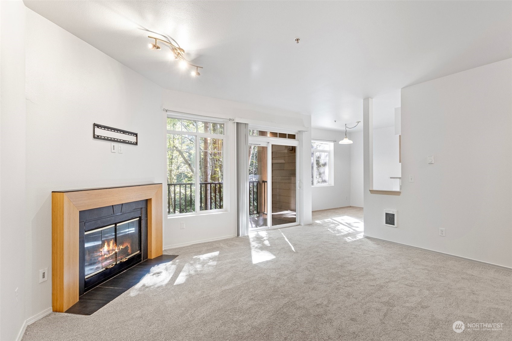 18930 Bothell Everett Highway, Unit V104 Bothell, WA 98012 - Photo 2 of 21 a view of an empty room with a fireplace