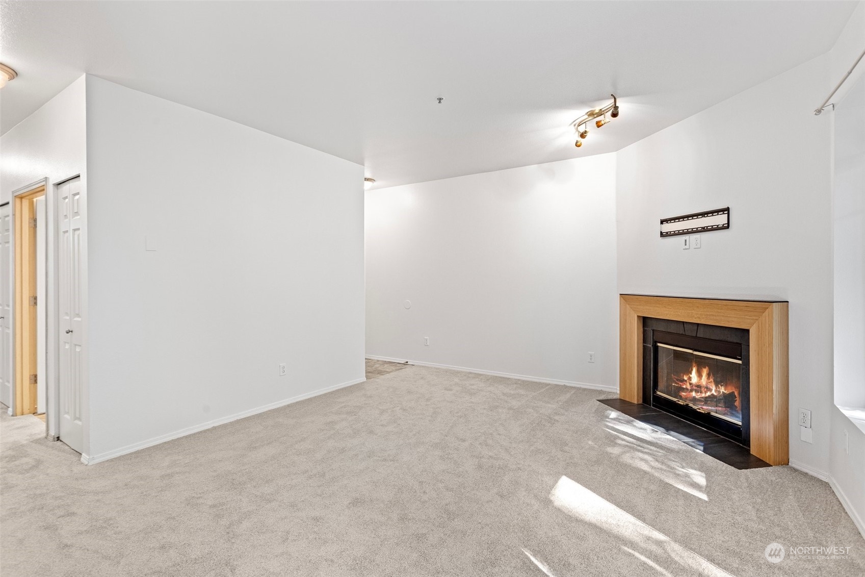 18930 Bothell Everett Highway, Unit V104 Bothell, WA 98012 - Photo 4 of 21 a view of an empty room with fire place