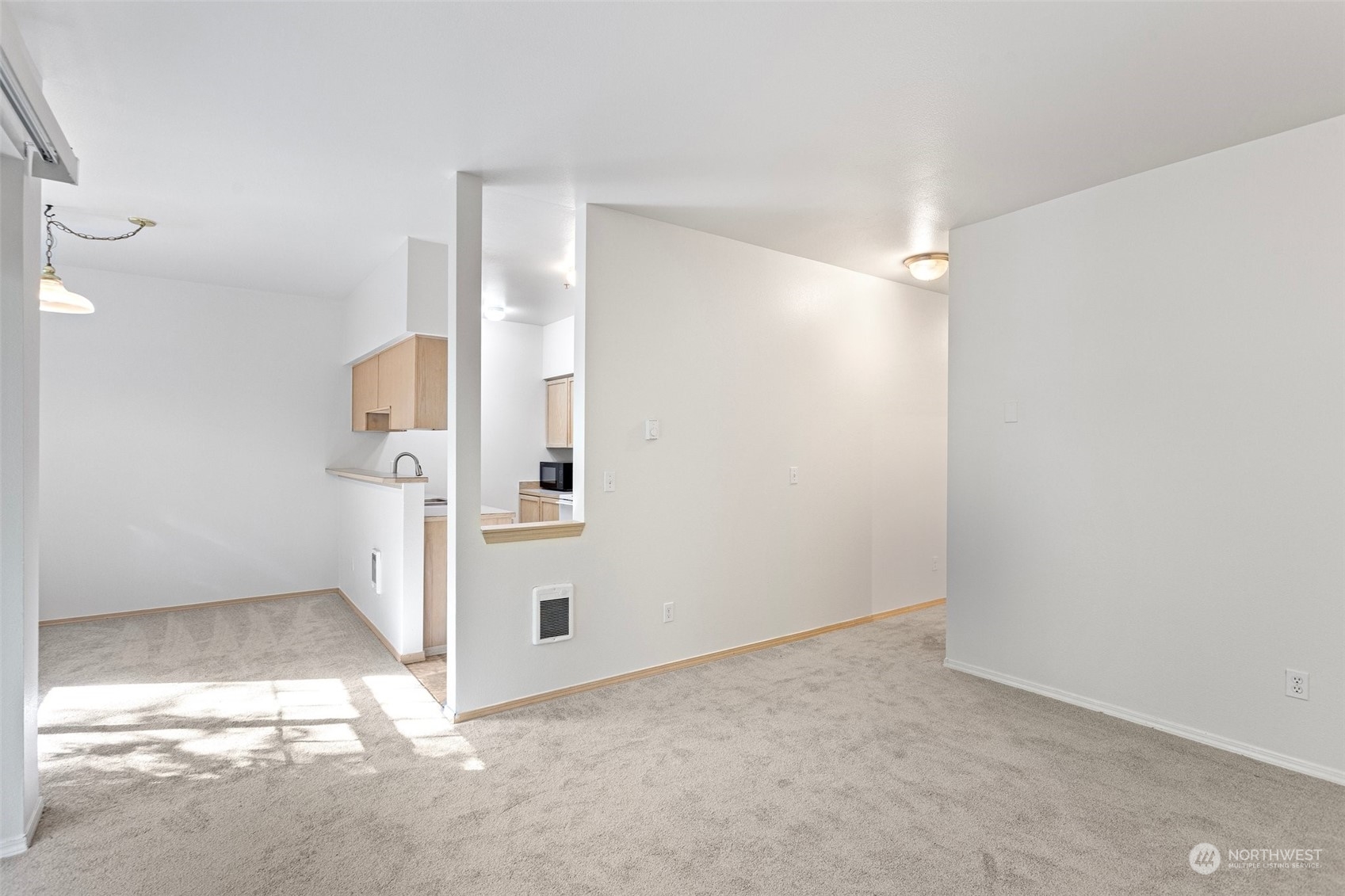 18930 Bothell Everett Highway, Unit V104 Bothell, WA 98012 - Photo 6 of 21 an empty room with a door