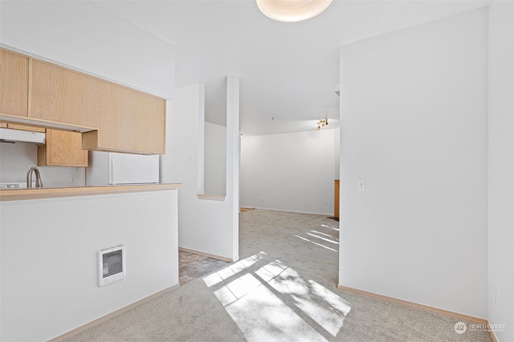 18930 Bothell Everett Highway, Unit V104 Bothell, WA 98012 - Photo 8 of 21 a bathroom with a sink and a mirror