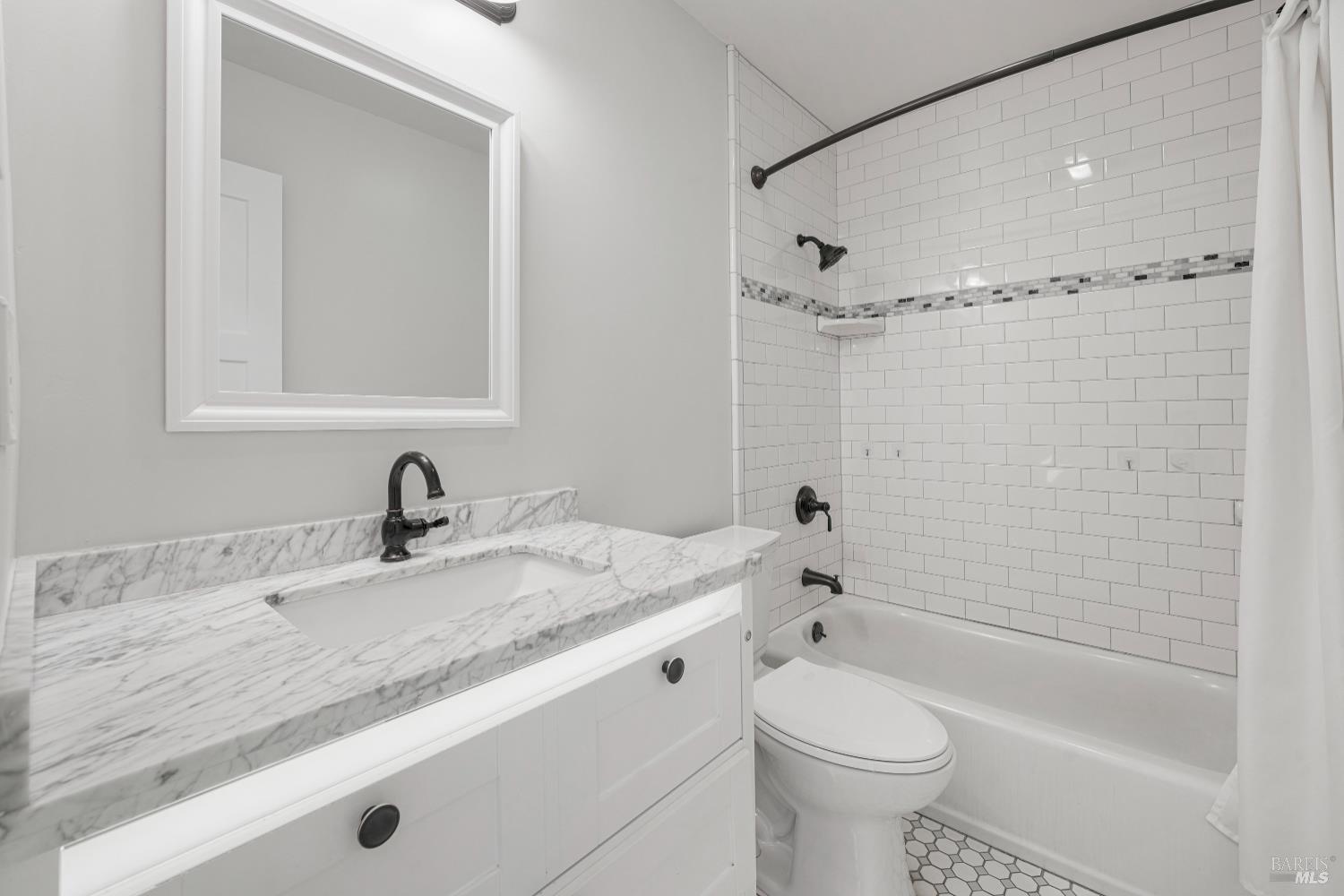 2129 Rockville Road Fairfield, CA 94534 - Photo 35 of 59 a bathroom with a granite countertop sink toilet and shower