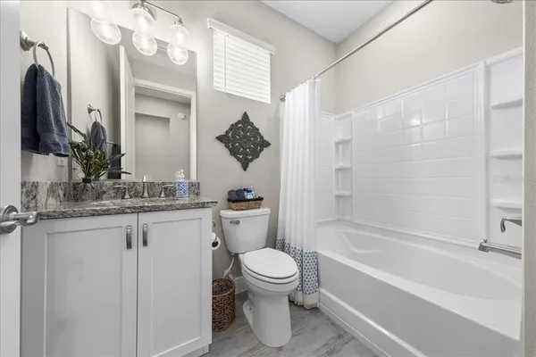 a bedroom with a bed and closet with night lamp