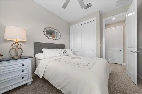 a bedroom with a bed and window