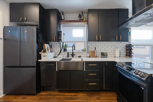 a kitchen with a sink and cabinets