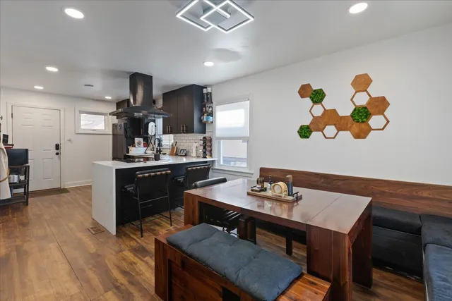a kitchen with a table and chairs in it