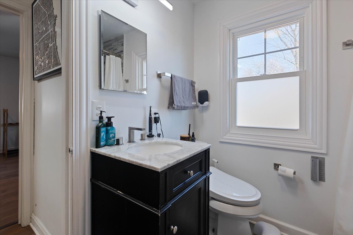 9527 South Damen Avenue Chicago, IL 60643 - Photo 7 of 33 a bathroom with a sink toilet and window