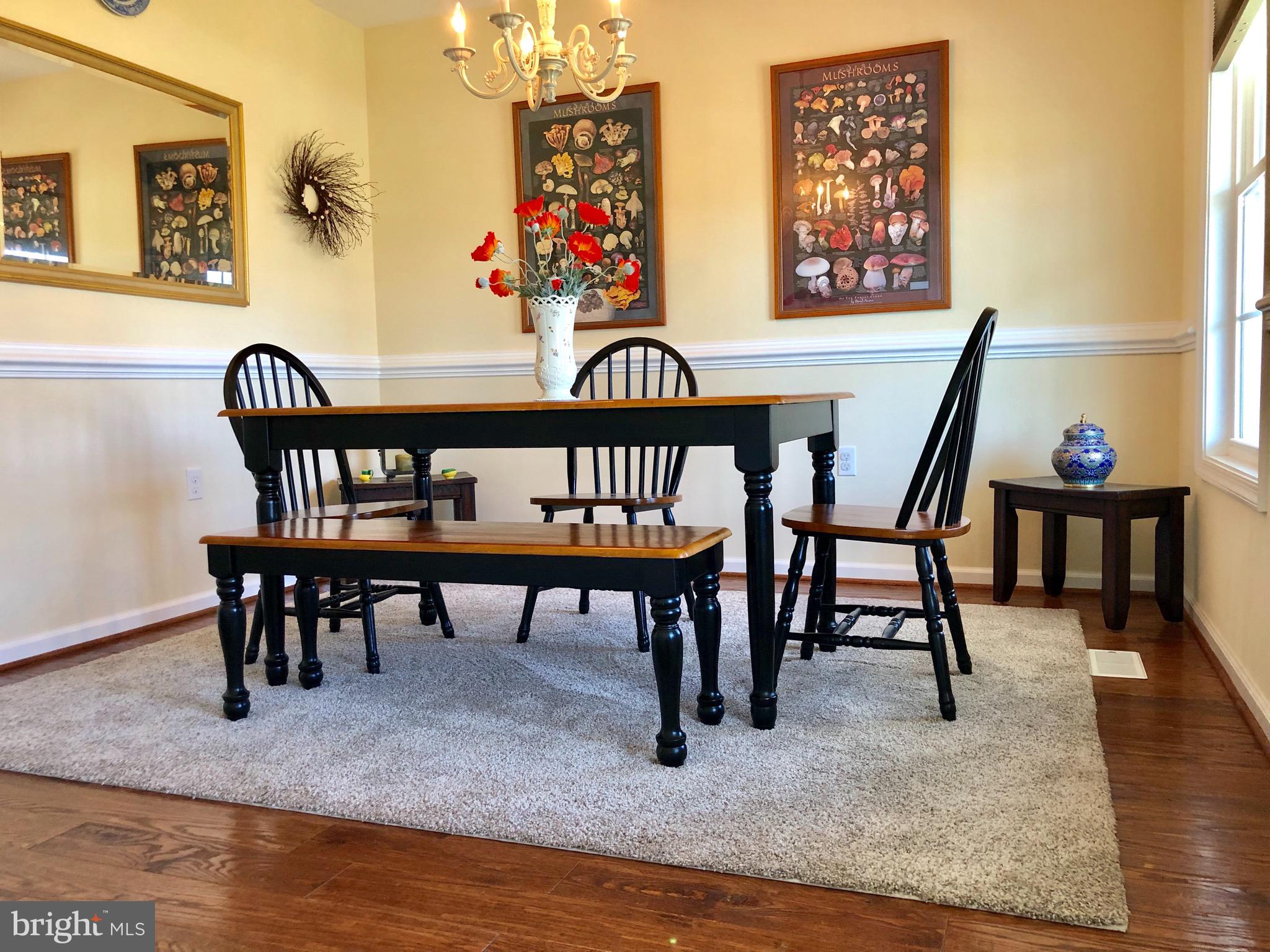 290 Alexis Drive Ranson, WV 25438 - Photo 5 of 33 dining rm with wood floors and chair rail molding