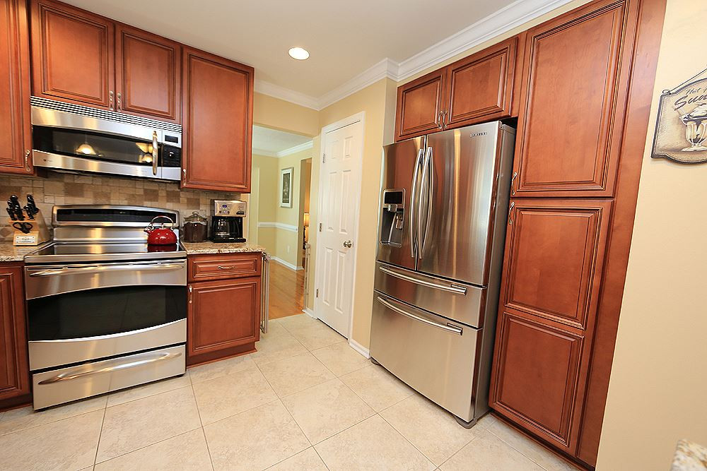 2104 Treverton Place Raleigh, NC 27609 - Photo 7 of 25 All stainless appliances, pantry and good lighting in this cook's kitchen. Kitchen