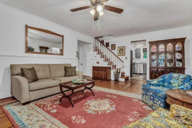 a living room with furniture and a rug