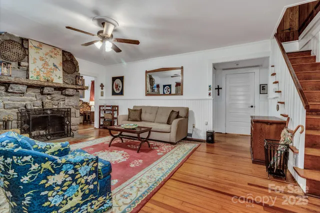 a living room with furniture and a fireplace