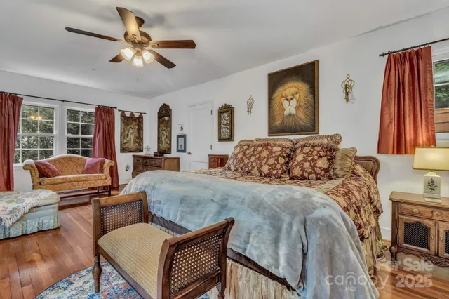 a bed room with a bed couch and a window