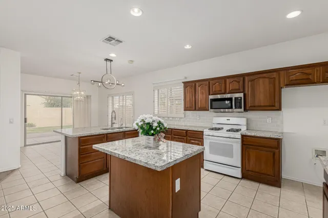 a view of an empty room with a ceiling fan