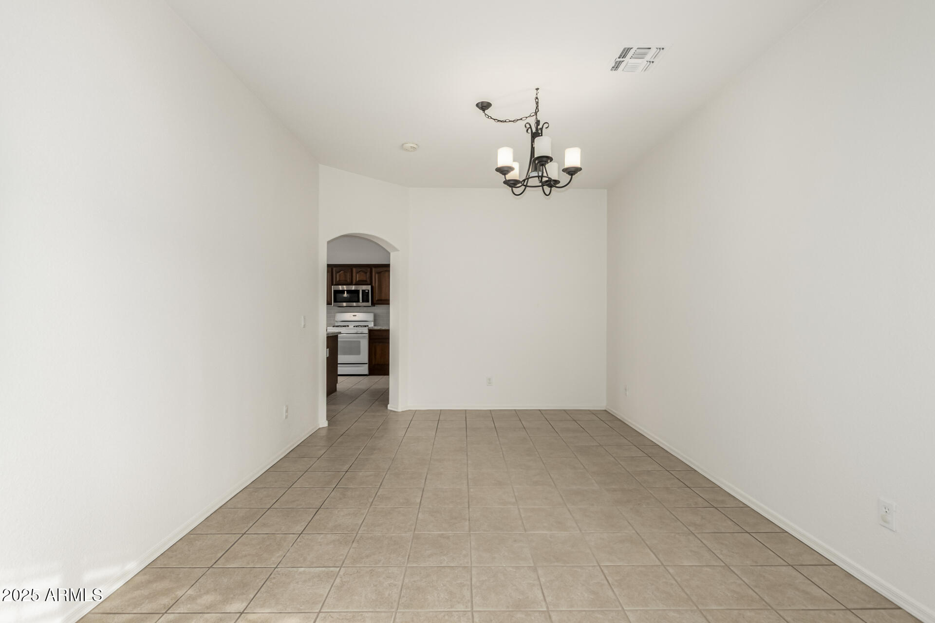 2978 East Ranch Court Gilbert, AZ 85296 - Photo 17 of 72 an empty room with a view of a kitchen