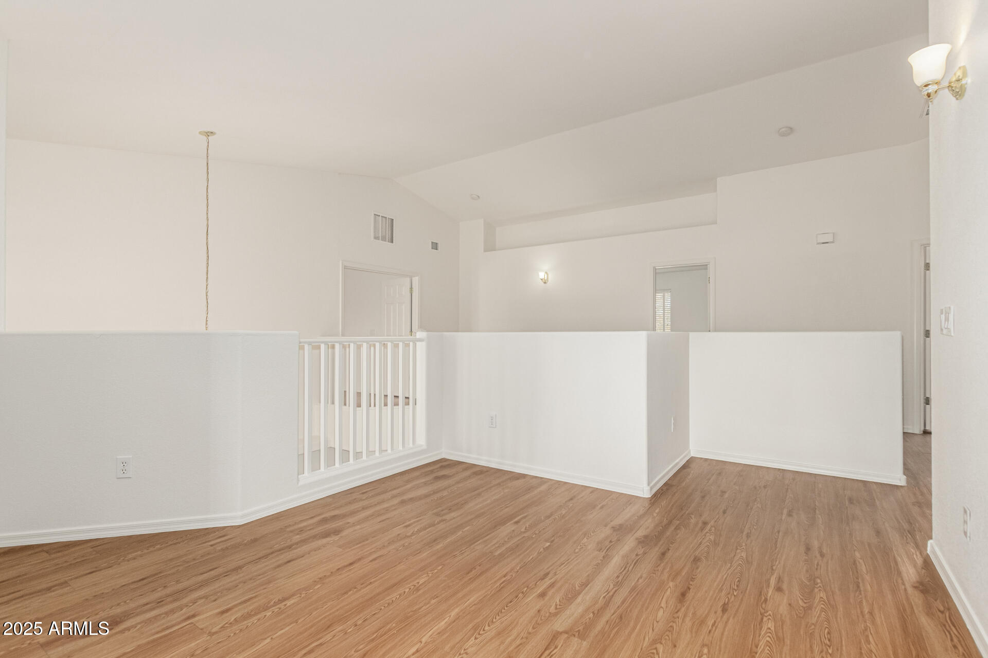 2978 East Ranch Court Gilbert, AZ 85296 - Photo 19 of 72 a view of an empty room with wooden floor