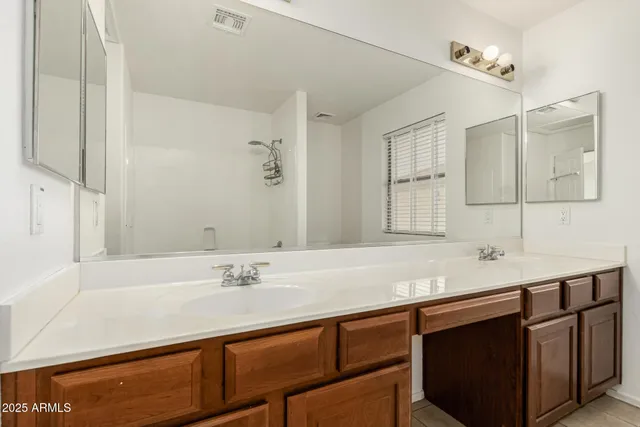 a kitchen with stainless steel appliances granite countertop sink wooden cabinets and a counter top space