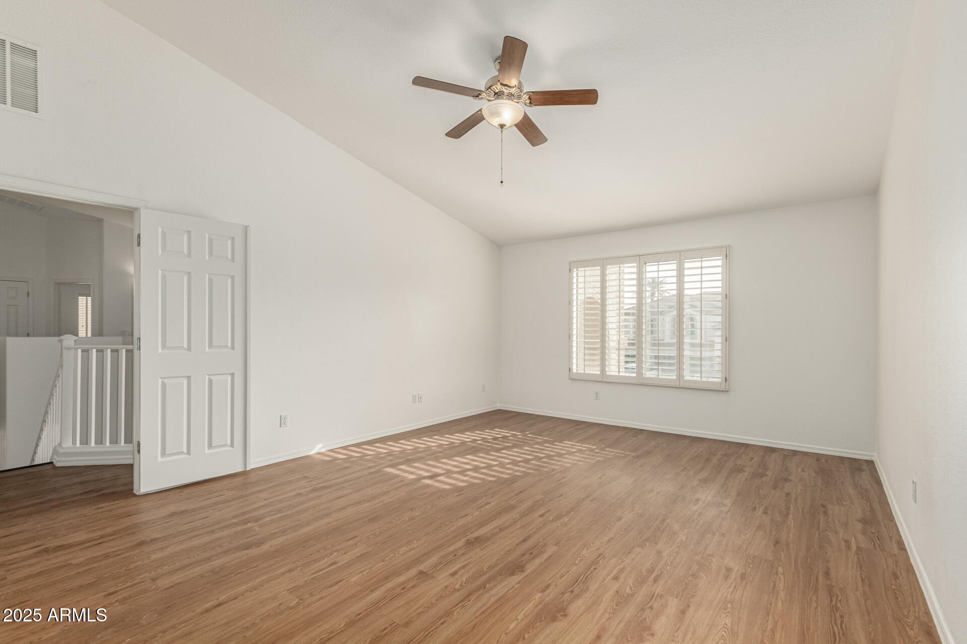 2978 East Ranch Court Gilbert, AZ 85296 - Photo 26 of 72 wooden floor in an empty room with a window