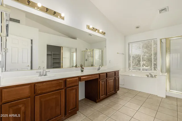a view of an empty room with a kitchen and fireplace
