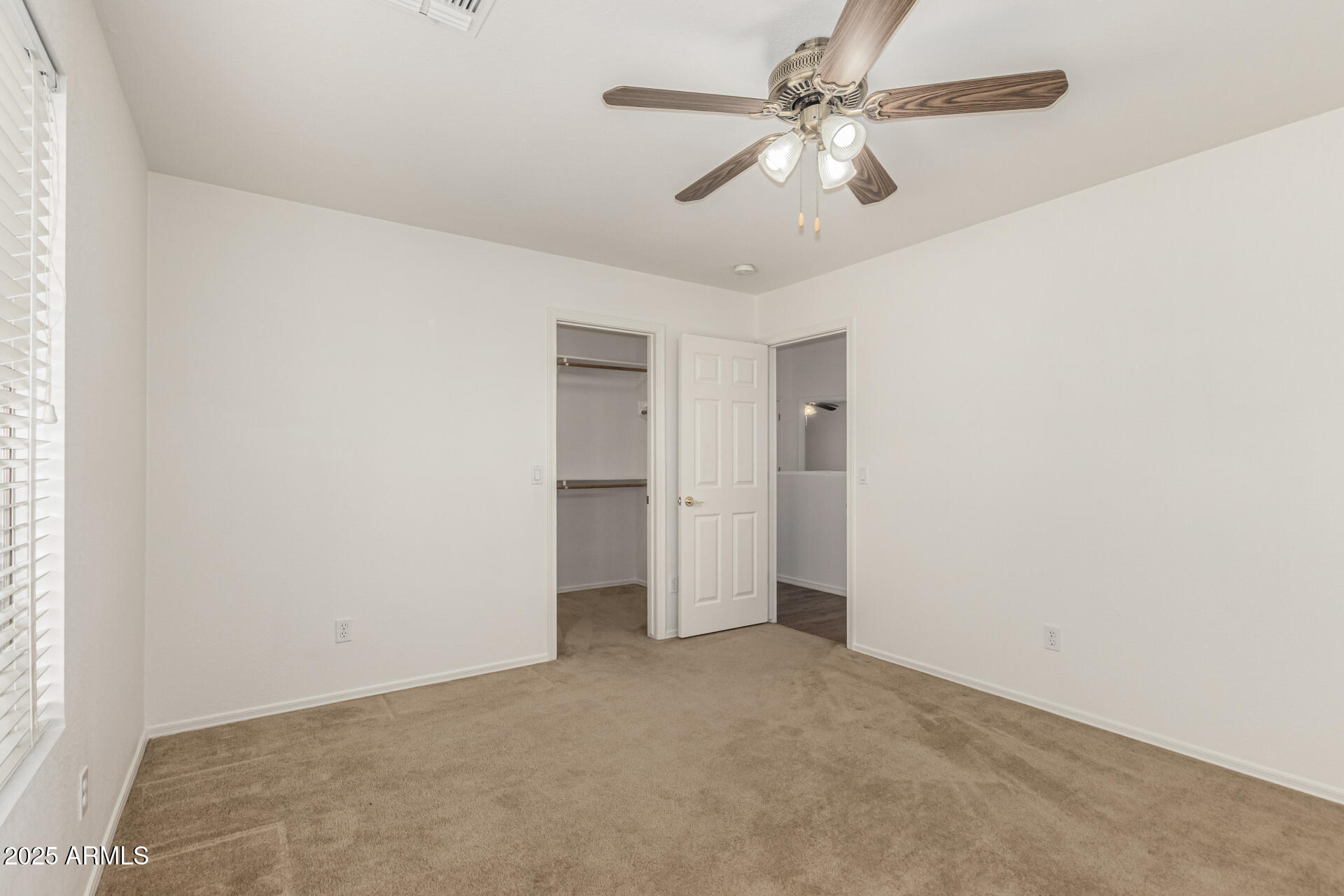 2978 East Ranch Court Gilbert, AZ 85296 - Photo 34 of 72 an empty room with a ceiling fan and a window
