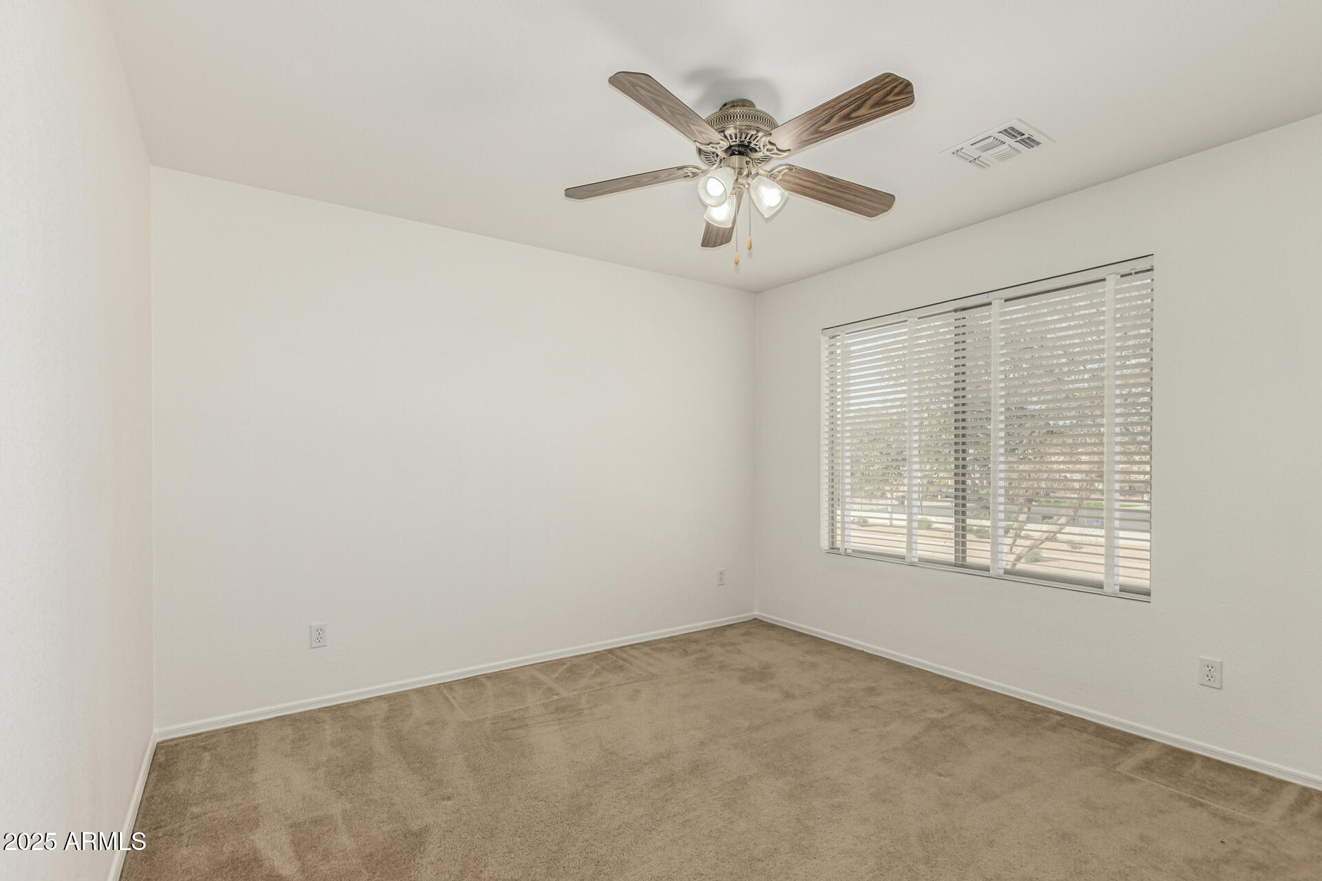 2978 East Ranch Court Gilbert, AZ 85296 - Photo 35 of 72 an empty room with windows and fan