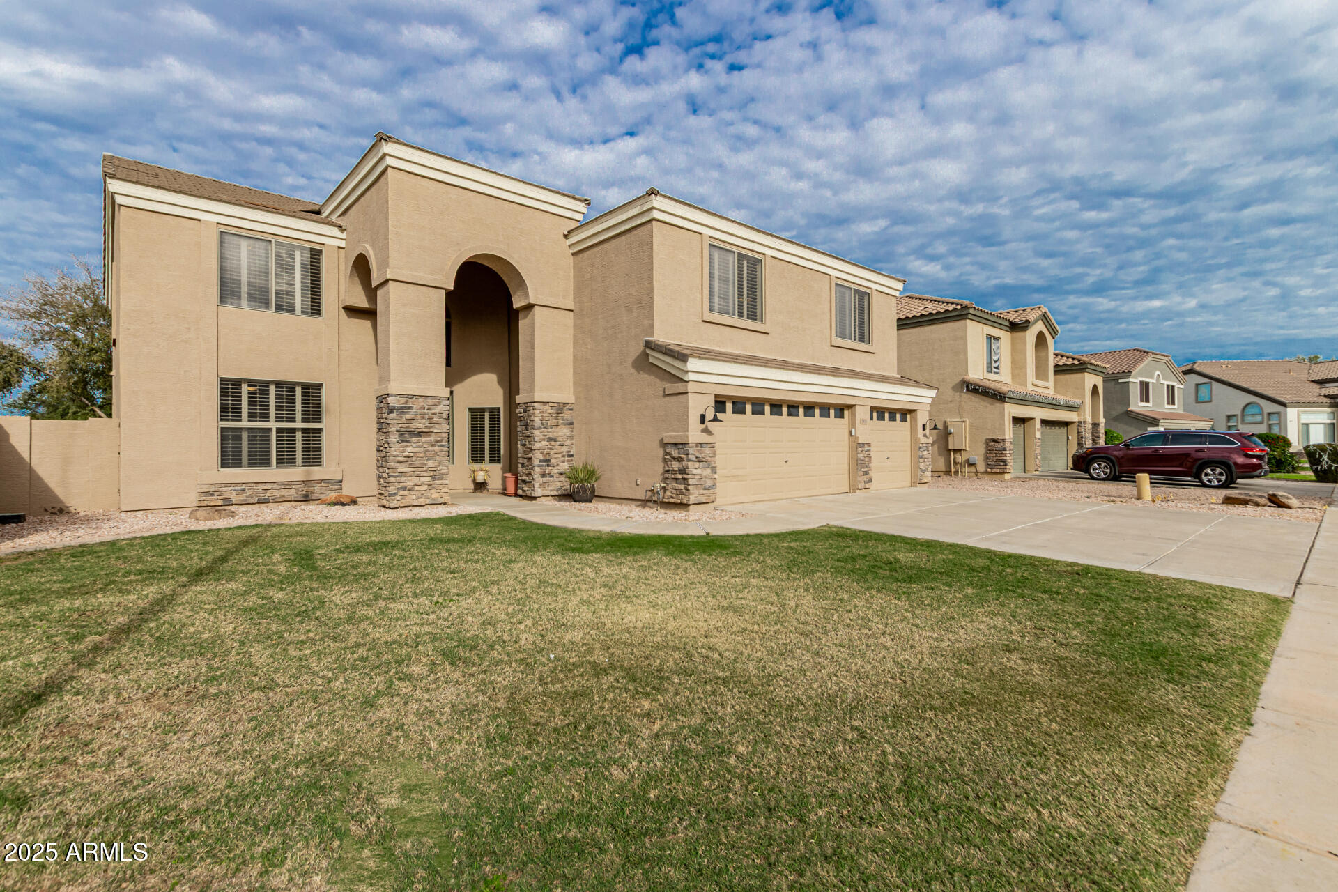 2978 East Ranch Court Gilbert, AZ 85296 - Photo 6 of 72 a front view of a house with a yard