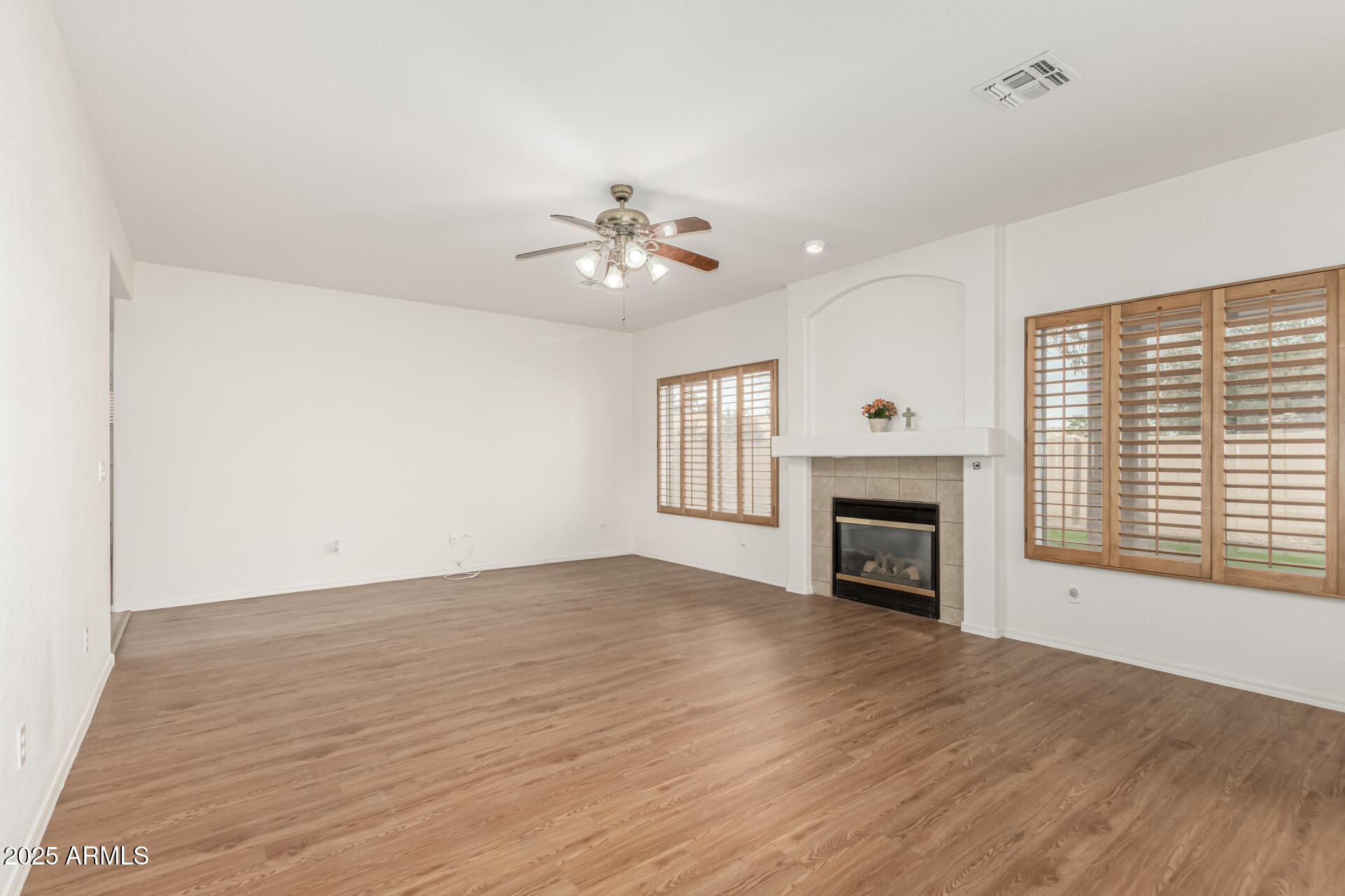 2978 East Ranch Court Gilbert, AZ 85296 - Photo 9 of 72 a view of an empty room with a fireplace and a window