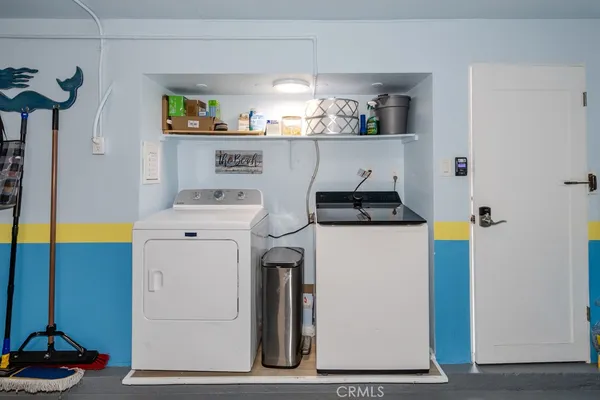 a bathroom with a granite countertop toilet sink and mirror
