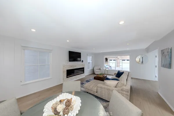 a living room with furniture a window and a table