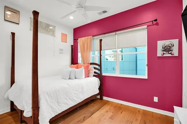 a view of a brick house that has lots of windows