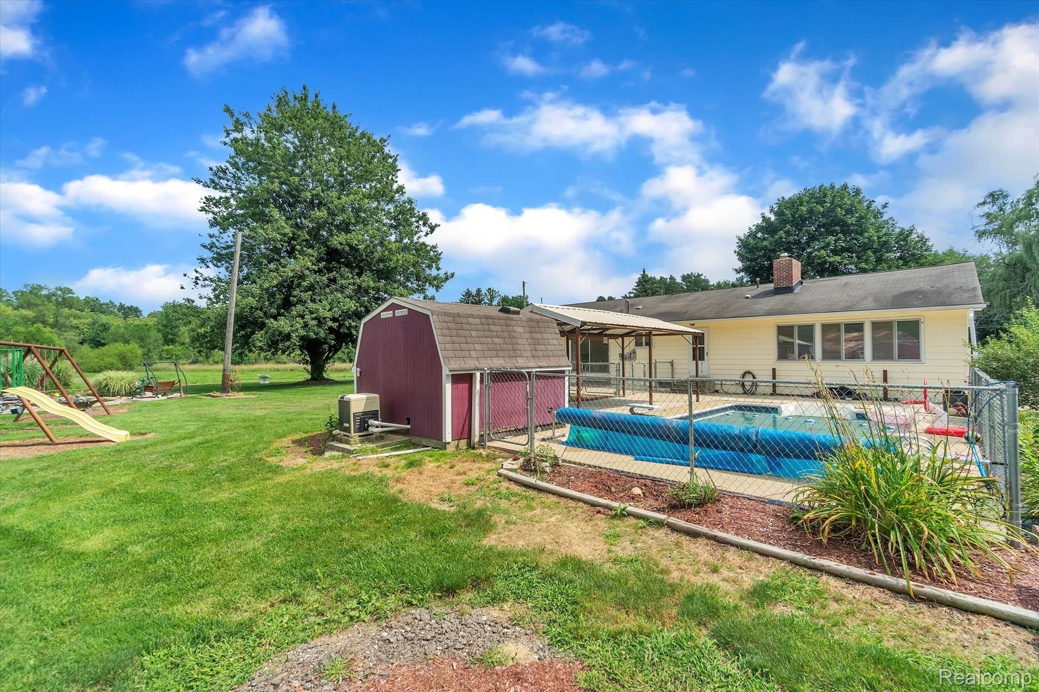 4661 Crooked Lake Road Howell, MI 48843 - Photo 30 of 47 Back/Side View of Home