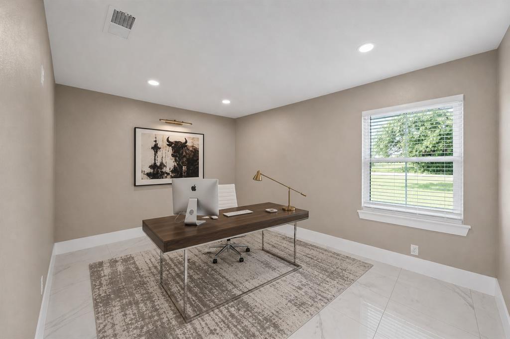 620 East 6th Street Springtown, TX 76082 - Photo 9 of 40 a living room with a couch and a table