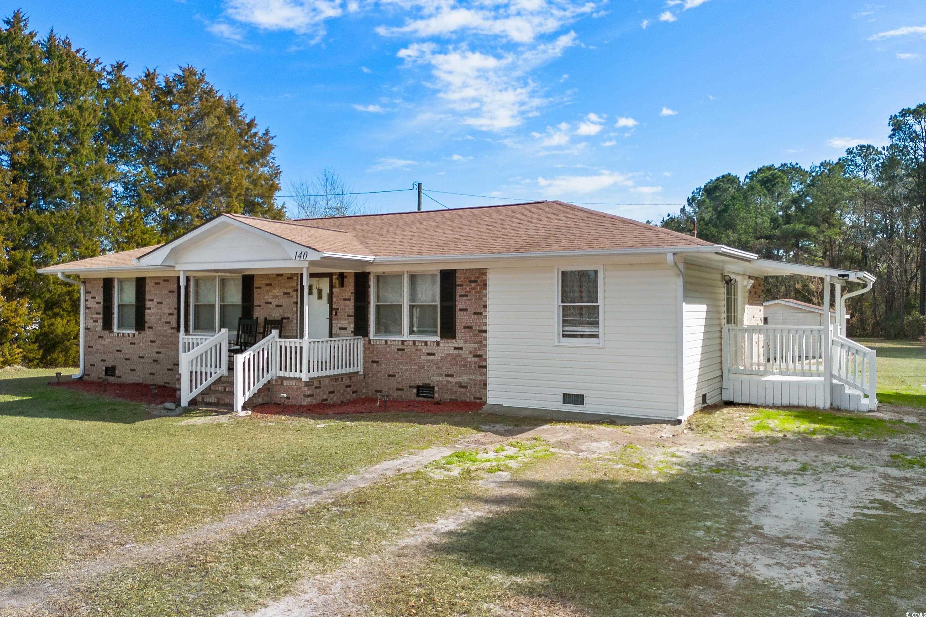 140 Flag Patch Road Loris, SC 29569 - Photo 2 of 38 Ranch-style house featuring a porch, a front yard,