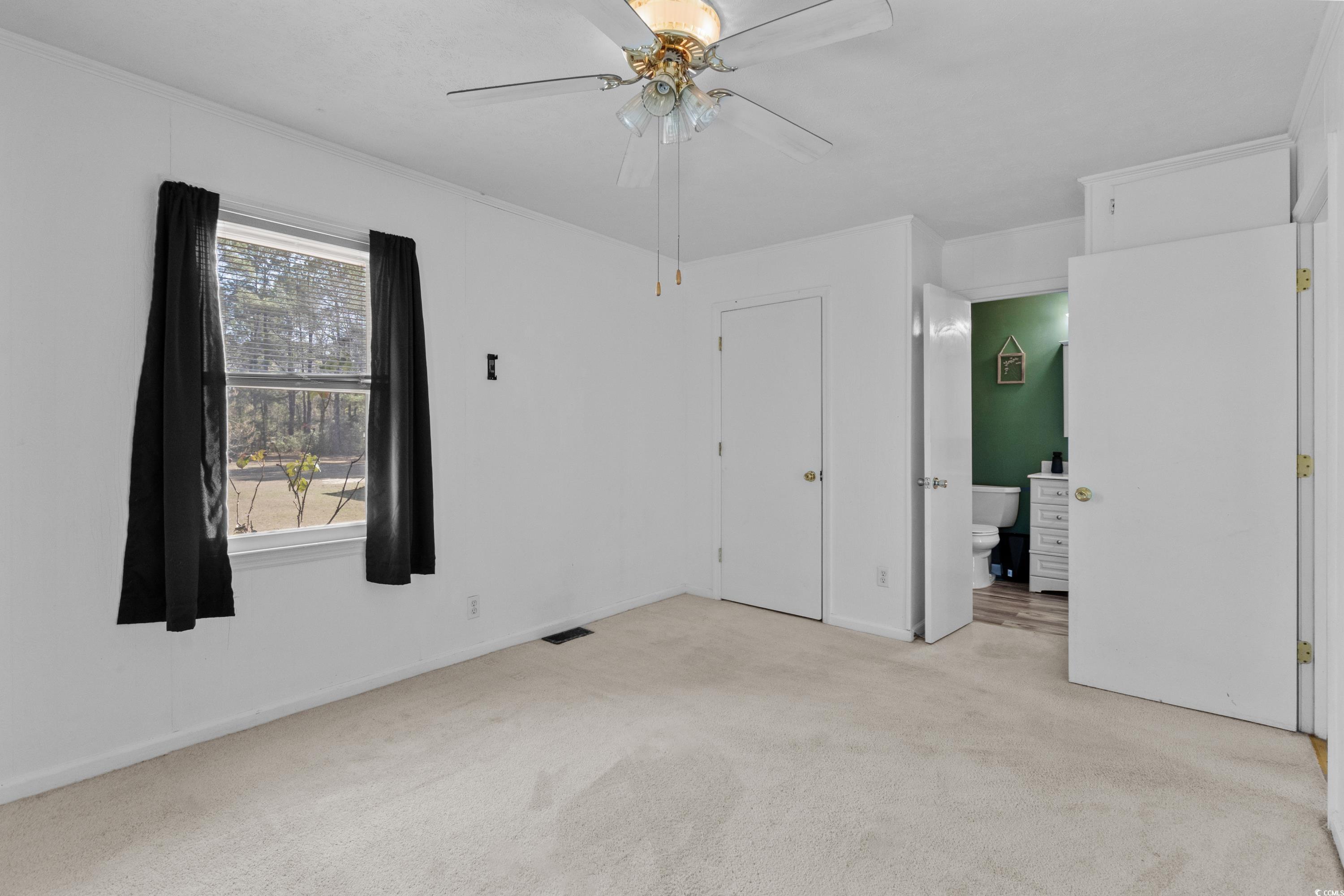 140 Flag Patch Road Loris, SC 29569 - Photo 25 of 38 Unfurnished bedroom featuring light carpet, visibl