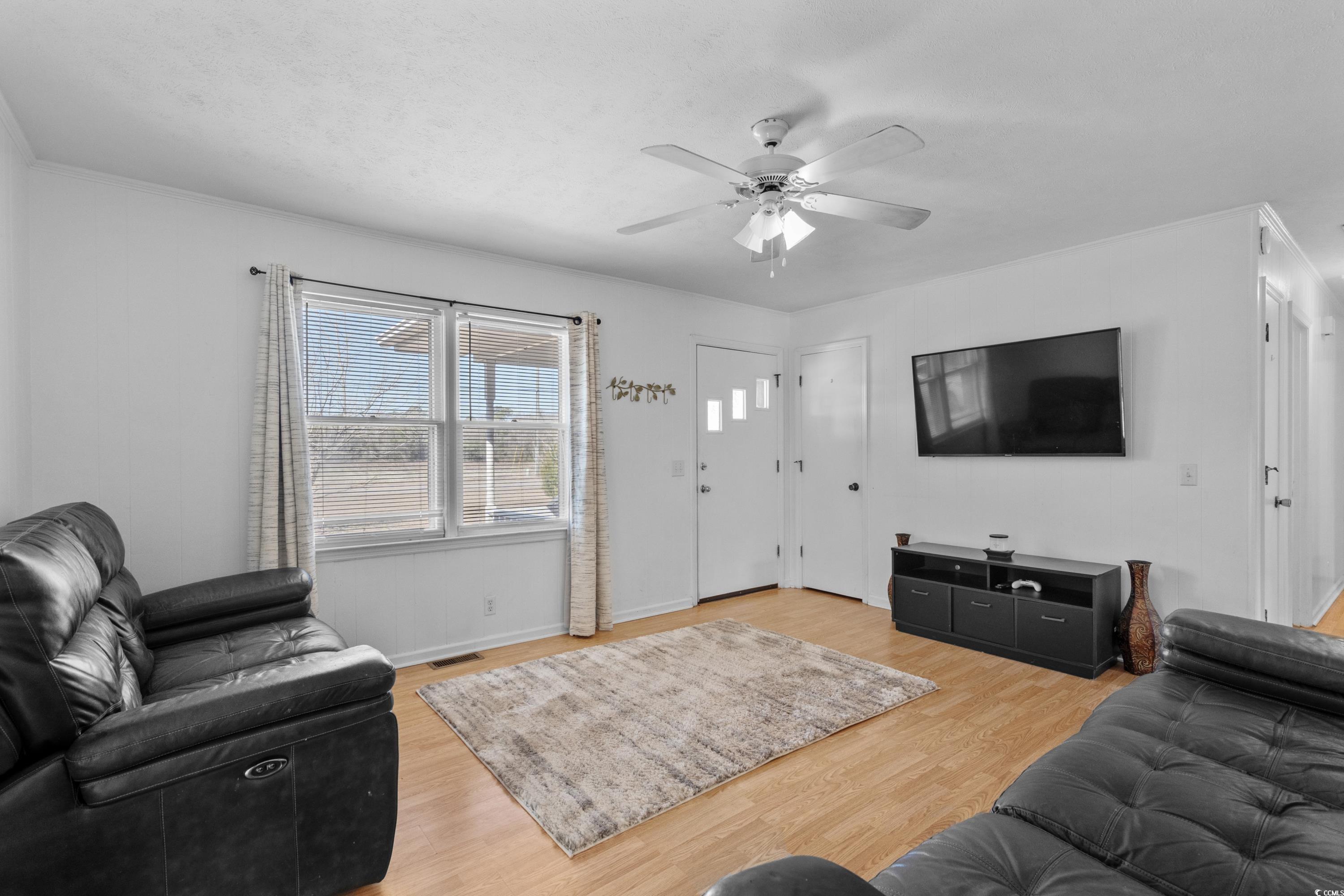 140 Flag Patch Road Loris, SC 29569 - Photo 6 of 38 Living room with visible vents, light wood-type fl