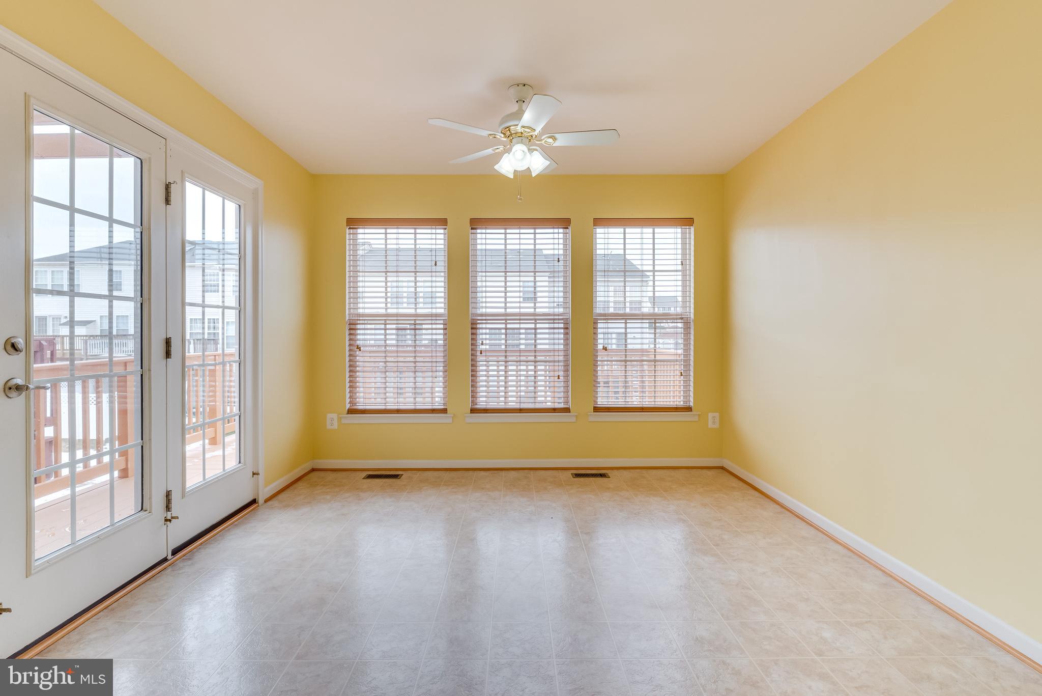 1253 Mare Street Ranson, WV 25438 - Photo 35 of 64 Glass paned doors + wall of windows let in the sun
